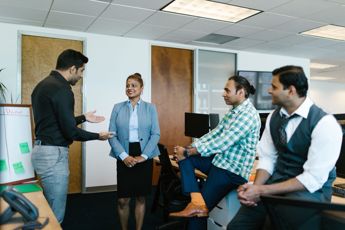 Colleagues talking together in an office